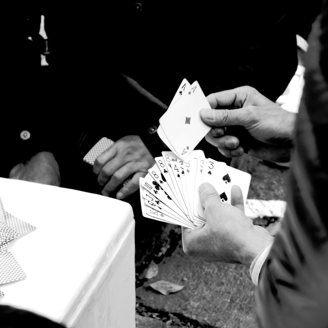 person holding playing cards