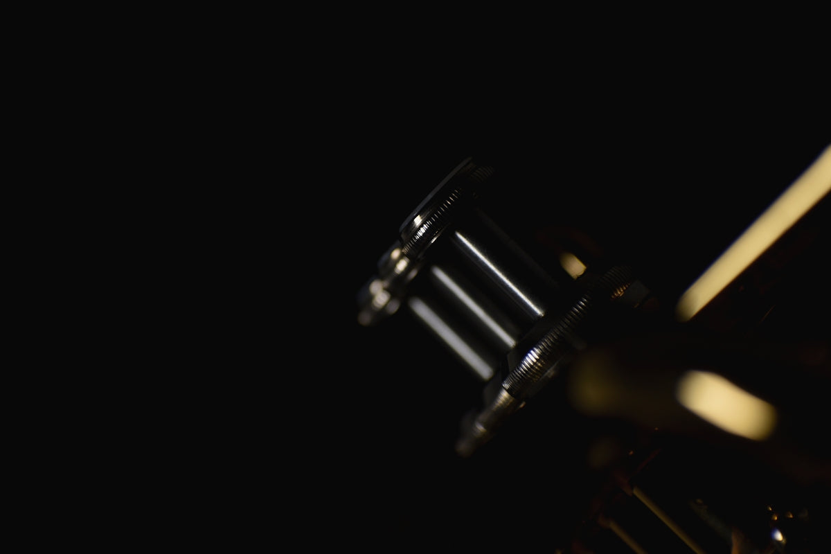 a close up of a metal object in the dark