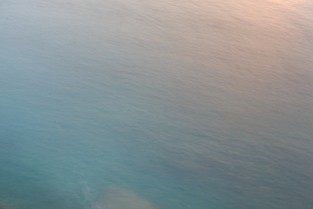 an airplane flying over a body of water