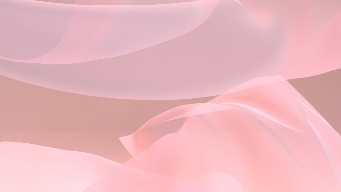 a close up of a pink and white background