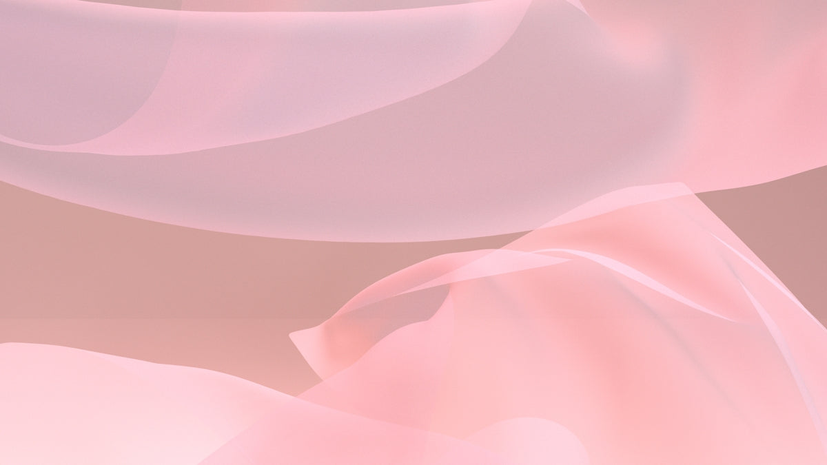 a close up of a pink and white background