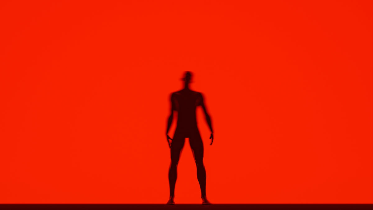 a shadow of a person standing in front of a red background