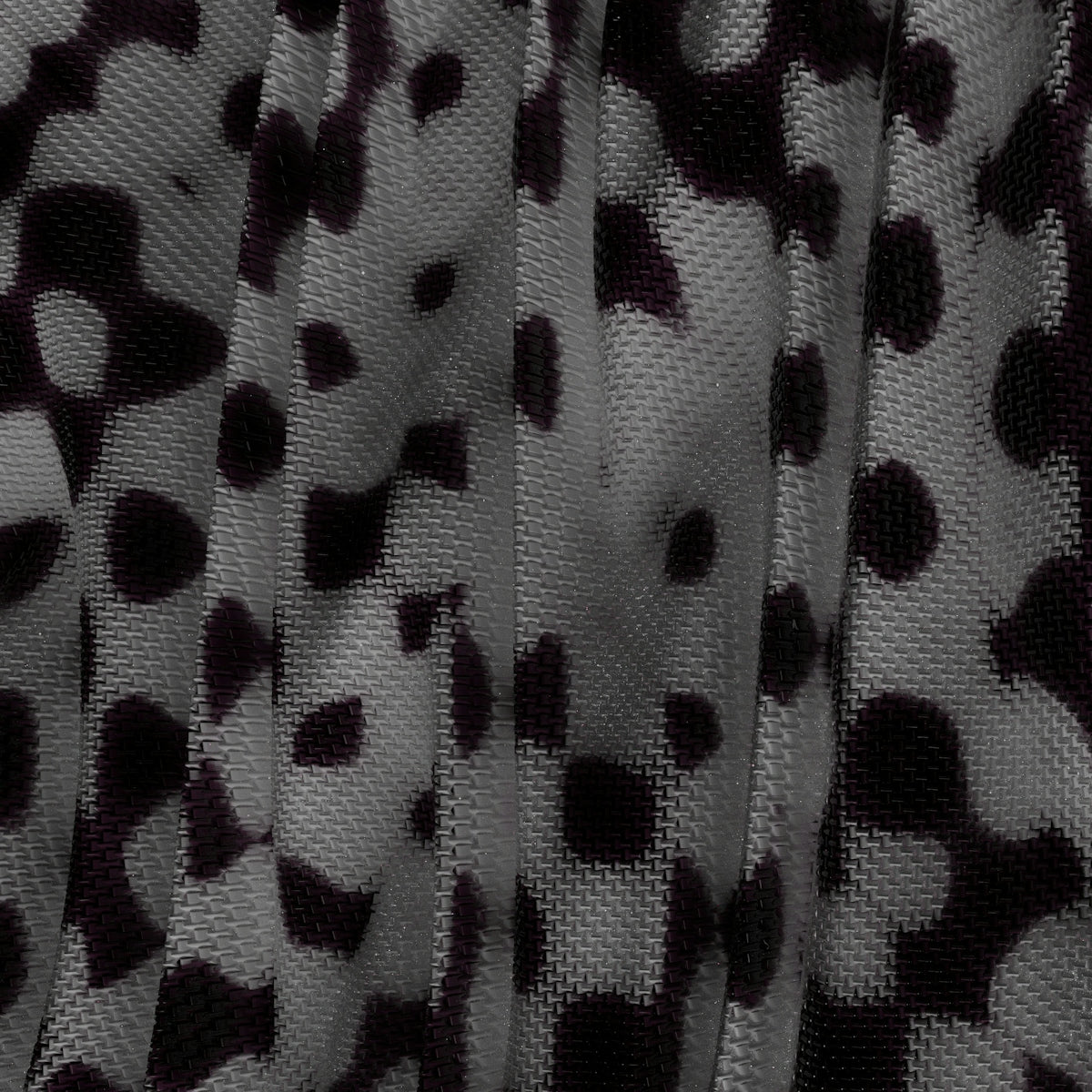 a close up of a black and white animal print fabric