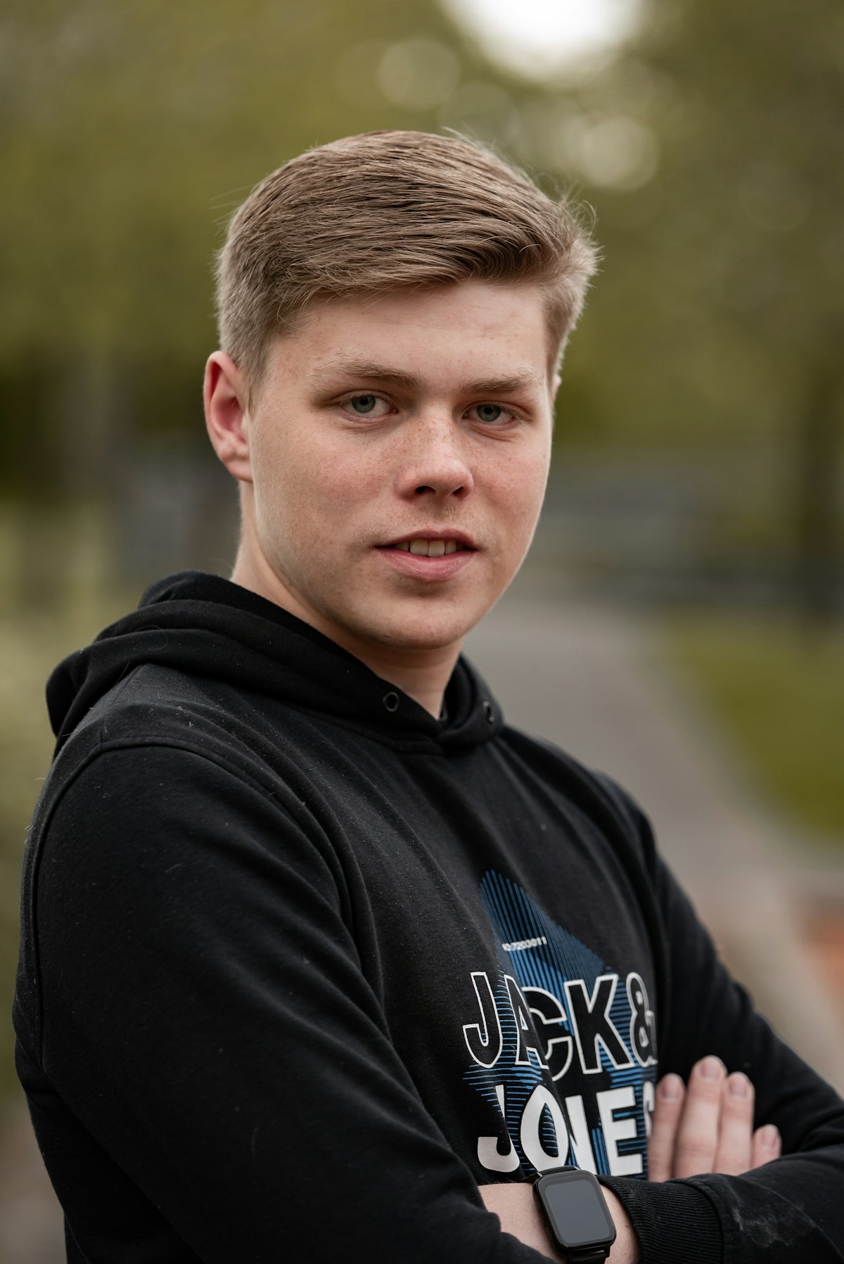 a young man is posing for a picture