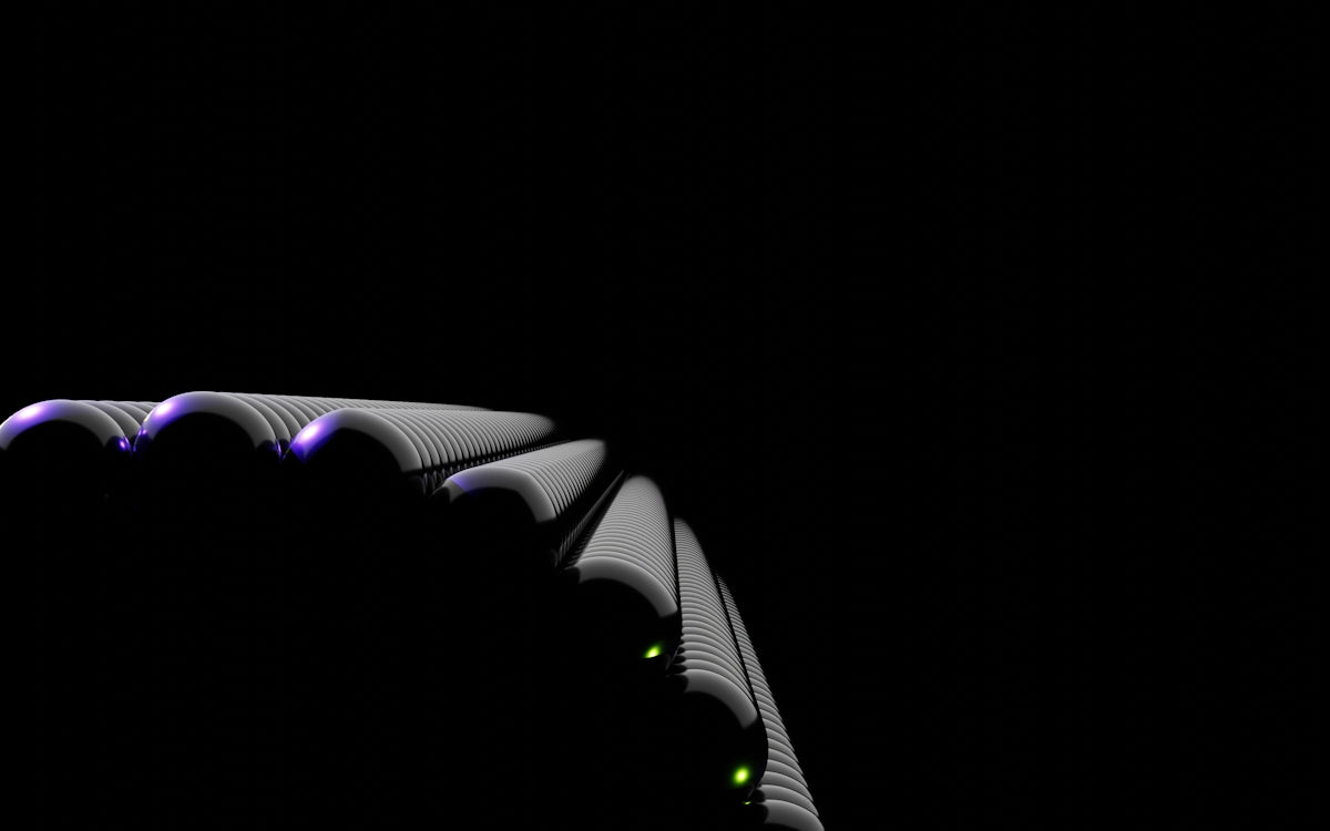 a black and white photo of a curved object in the dark