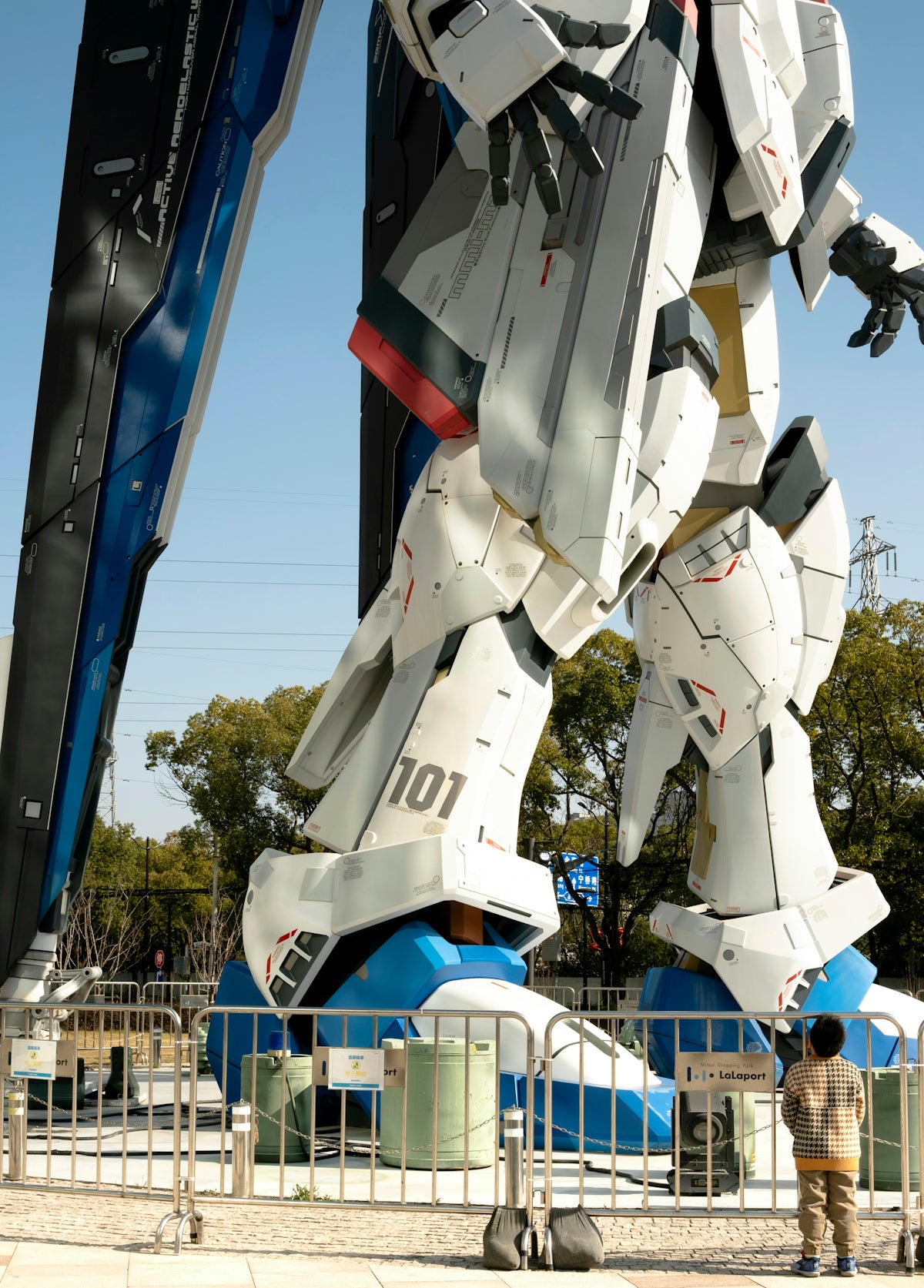 a giant robot is standing in front of a building