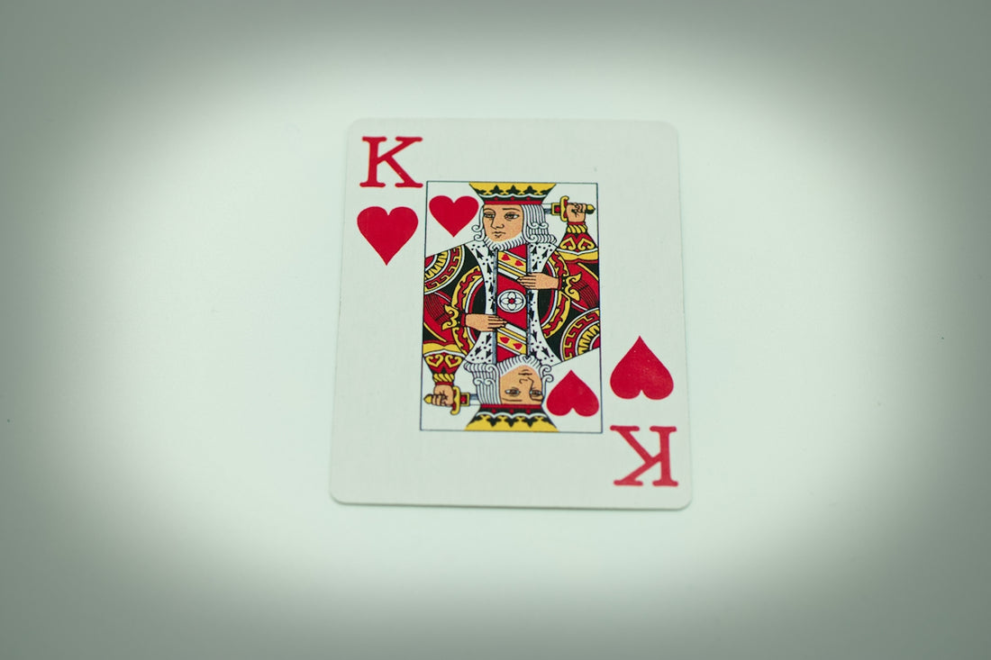 a playing card with a king of hearts on it