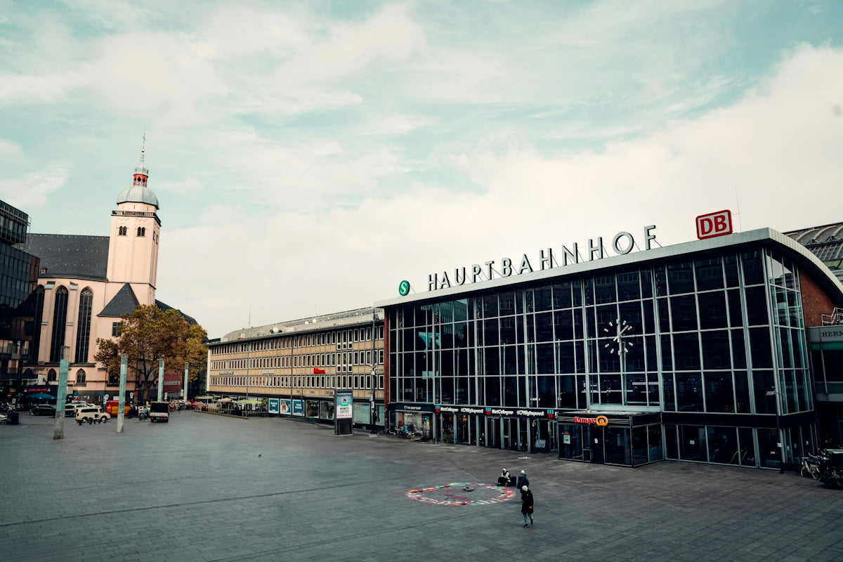 A large building with a clock tower in the background