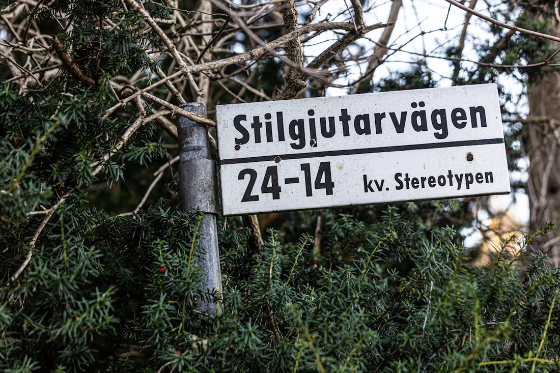 A street sign in front of some trees
