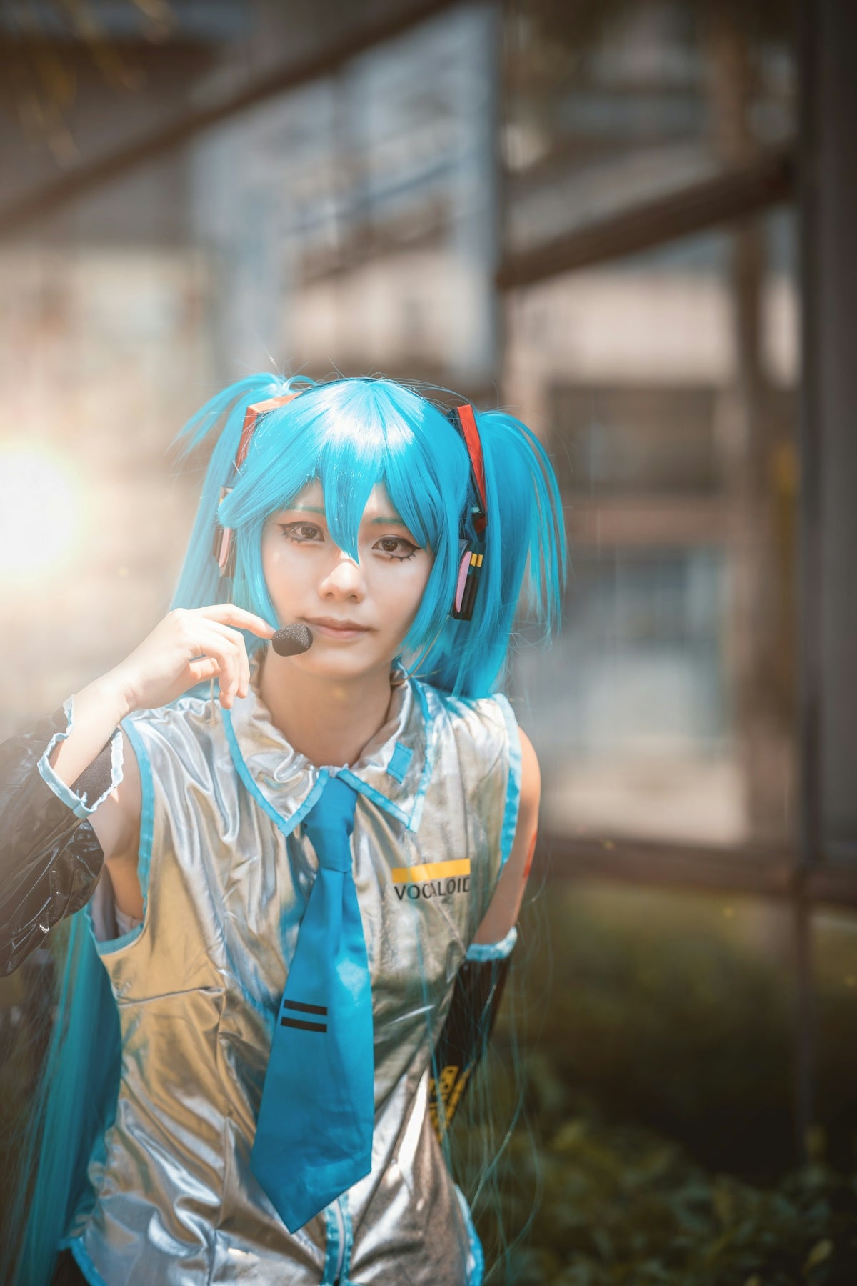 A cosplayer dressed as anime character hatsune miku