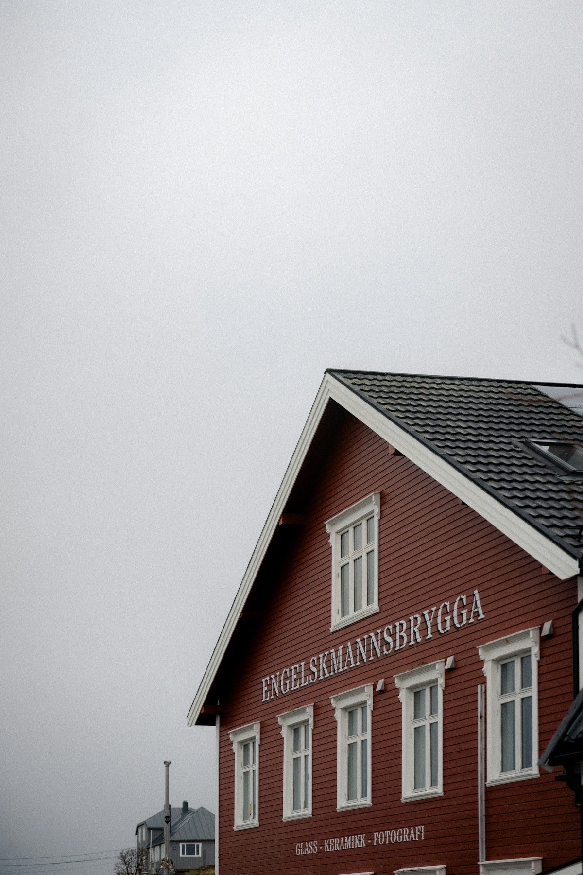 A red building with white lettering and windows.