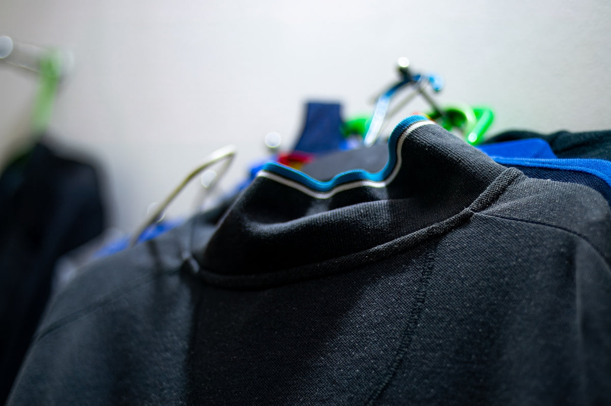 Clothes hanging on a rack inside.