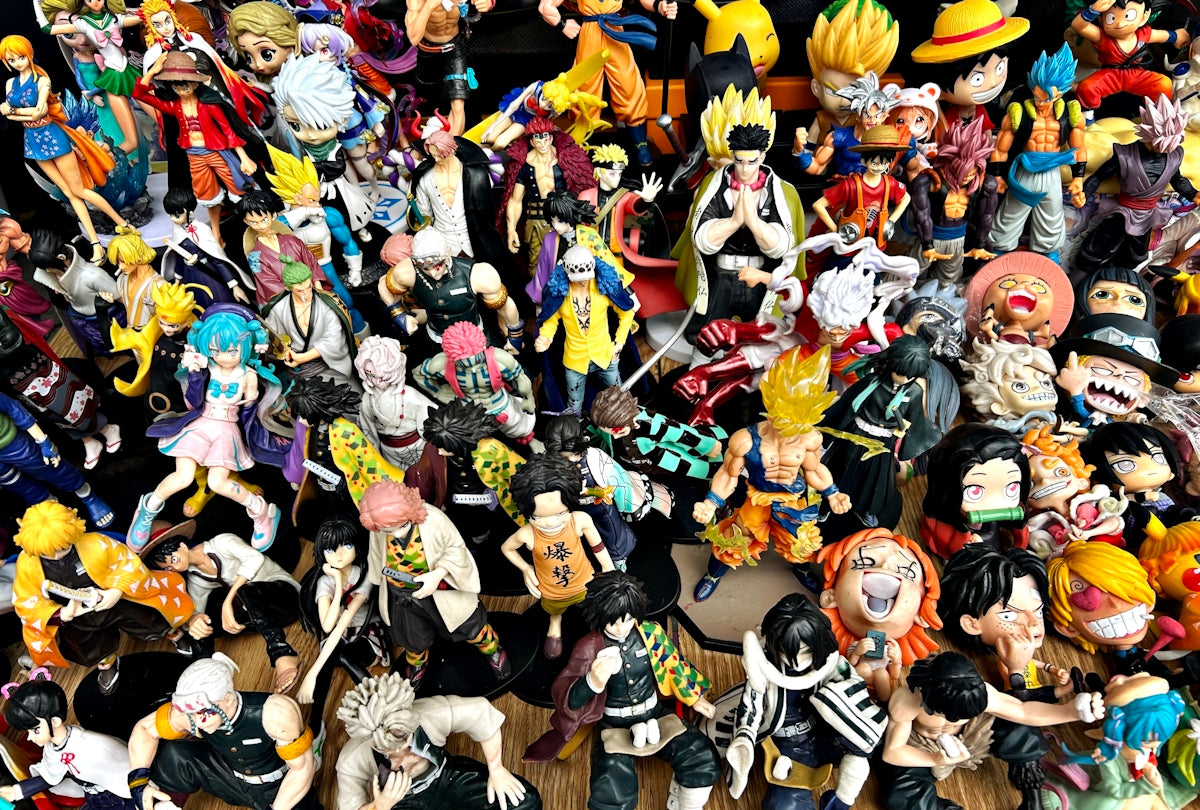 A large collection of anime action figures displayed together